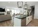 Bright open-concept space showcases a kitchen with an island, stainless appliances, and a spacious living area at 761 Stone Trace Ct, Avon, IN 46123