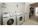 Well-lit laundry room with modern appliances and storage at 761 Stone Trace Ct, Avon, IN 46123