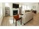 Comfortable living area with a fireplace, entertainment center, and a view into the dining room, promoting open living at 761 Stone Trace Ct, Avon, IN 46123