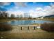 Beautiful pond view in the community with a bench and decorative swan, perfect for relaxation at 761 Stone Trace Ct, Avon, IN 46123