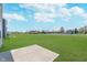 Spacious backyard with a concrete patio and views of the community at 7658 Hillway Dr, Indianapolis, IN 46113