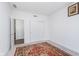Clean and bright bedroom with neutral walls, carpet floors, and a double-door closet for storage at 7658 Hillway Dr, Indianapolis, IN 46113