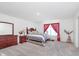 Spacious bedroom featuring carpet floors, ample natural light, and neutral decor for a relaxing ambiance at 7658 Hillway Dr, Indianapolis, IN 46113