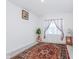 Bright bedroom with a decorative rug, natural light, and neutral walls, creating a cozy atmosphere at 7658 Hillway Dr, Indianapolis, IN 46113