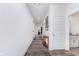 Long hallway with wood-look floors, white walls, and recessed lighting, leading to various rooms in the home at 7658 Hillway Dr, Indianapolis, IN 46113