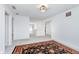 Bright hallway with carpet floors, white walls, and stylish lighting, connecting various living spaces at 7658 Hillway Dr, Indianapolis, IN 46113