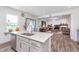 Open-concept kitchen with a spacious island, stainless steel appliances, and seamless flow into the living room, great for entertaining at 7658 Hillway Dr, Indianapolis, IN 46113