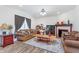 Inviting living room with a warm fireplace, plush seating, and stylish decor, creating a comfortable and relaxing atmosphere at 7658 Hillway Dr, Indianapolis, IN 46113
