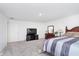 Spacious main bedroom features neutral carpet, a TV, and a dresser at 7658 Hillway Dr, Indianapolis, IN 46113