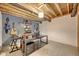 Basement space with music room with instruments, finished walls, and exposed ceiling at 7859 Moore Rd, Gosport, IN 47433