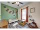 Cozy bedroom with a ceiling fan and ample natural light at 7859 Moore Rd, Gosport, IN 47433