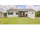 Charming single-story home with white siding, black shutters, and a bright red front door at 7859 Moore Rd, Gosport, IN 47433