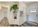 Welcoming foyer with built-in shelving, coat rack, and stylish flooring at 7859 Moore Rd, Gosport, IN 47433