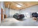 Spacious garage featuring room for car, storage, and overhead door at 7859 Moore Rd, Gosport, IN 47433