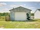 Exterior shot of detached garage featuring a new overhead door at 7859 Moore Rd, Gosport, IN 47433
