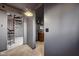 A bright hallway leading to a spiral staircase at 7859 Moore Rd, Gosport, IN 47433
