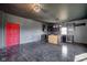 Kitchen with dark finishes, black tile floors, and a contrasting red door at 7859 Moore Rd, Gosport, IN 47433