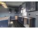 A newly updated kitchen featuring stainless steel appliances and custom cabinetry at 7859 Moore Rd, Gosport, IN 47433