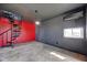 A spacious room featuring a spiral staircase and modern fixtures at 7859 Moore Rd, Gosport, IN 47433