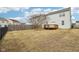 The backyard features a wood deck, fence, and healthy green grass at 8074 Carina Dr, Indianapolis, IN 46268
