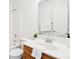Well-lit bathroom with a single sink, wooden vanity, and shower-tub combo at 8074 Carina Dr, Indianapolis, IN 46268