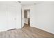 Bright bedroom with light hardwood floors and a doorway to an upper-level hallway at 8074 Carina Dr, Indianapolis, IN 46268