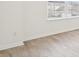 Bright bedroom featuring light hardwood floors and large sunny windows at 8074 Carina Dr, Indianapolis, IN 46268
