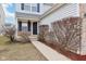 Inviting walkway to front door, accented by neat landscaping and charming architectural details at 8074 Carina Dr, Indianapolis, IN 46268