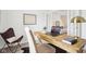 A bright home office featuring a wood desk, modern chair, hardwood floors, and natural light at 8074 Carina Dr, Indianapolis, IN 46268