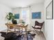 Bright home office with modern desk, stylish seating, and a light-filled window at 8074 Carina Dr, Indianapolis, IN 46268