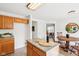 Kitchen island with wine and glasses in view of table and chairs at 8074 Carina Dr, Indianapolis, IN 46268