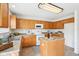 Bright kitchen with wood cabinets, island and appliances with eat-in area at 8074 Carina Dr, Indianapolis, IN 46268