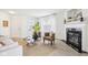 Bright and airy living room with a fireplace, neutral decor, and plenty of natural light at 8074 Carina Dr, Indianapolis, IN 46268