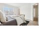Bright bedroom featuring a bed, hardwood floors, and a light-filled window at 8074 Carina Dr, Indianapolis, IN 46268