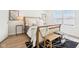 Bright bedroom featuring a bed, hardwood floors, a bamboo bench, and modern wall art at 8074 Carina Dr, Indianapolis, IN 46268
