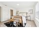 Bedroom featuring a bed, hardwood floors, a bamboo bench, and modern wall art at 8074 Carina Dr, Indianapolis, IN 46268