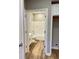 Bathroom featuring clean, white fixtures and modern wood-look flooring at 857 N Oakland Ave, Indianapolis, IN 46201