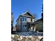 View of the new construction home featuring a covered porch and modern design at 857 N Oakland Ave, Indianapolis, IN 46201