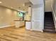 Open kitchenette features an island with seating and modern pendant lighting at 857 N Oakland Ave, Indianapolis, IN 46201