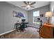 Simple room featuring a desk, exercise bike, and neutral decor at 8727 Faulkner Dr, Indianapolis, IN 46239