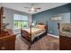 Relaxing bedroom with wood furniture, natural light, and neutral-toned decor at 8727 Faulkner Dr, Indianapolis, IN 46239