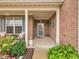A welcoming front porch with brick columns, seating, and decorative touches adding charm at 8727 Faulkner Dr, Indianapolis, IN 46239