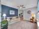 Comfortable living room featuring a sofa and a stylish accent wall, perfect for relaxing at 8727 Faulkner Dr, Indianapolis, IN 46239