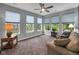 Bright room with a comfortable sofa and large windows offering plenty of natural light at 8727 Faulkner Dr, Indianapolis, IN 46239
