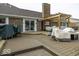 Large backyard featuring wood deck and brick accents creating a charming and inviting outdoor space at 8901 Rocky Ridge Rd, Indianapolis, IN 46217