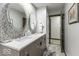 Modern bathroom with dual sinks, updated countertop, and a view into the water closet at 8901 Rocky Ridge Rd, Indianapolis, IN 46217