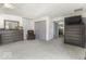 Bedroom showcases plush carpet, modern dresser and closet, with a chair that complements the soothing color scheme at 8901 Rocky Ridge Rd, Indianapolis, IN 46217