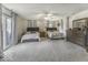 Spacious bedroom featuring two beds, neutral decor, and a sliding door that allows for natural light at 8901 Rocky Ridge Rd, Indianapolis, IN 46217