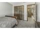Cozy bedroom featuring a bed, double closet, and an en suite bathroom at 8901 Rocky Ridge Rd, Indianapolis, IN 46217