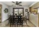 Dining area with a wooden table, comfortable chairs, and sliding doors leading outdoors at 8901 Rocky Ridge Rd, Indianapolis, IN 46217